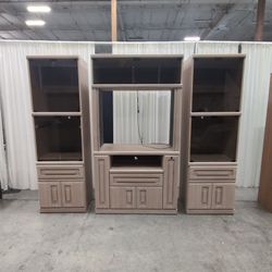 Light Wood Three-Piece Entertainment Center with Smoked Glass Doors