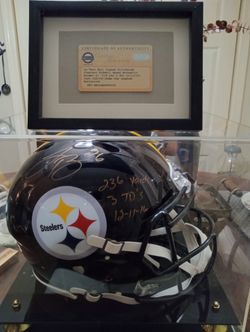 Levon bell signed inscribed helmet in display case with certificate of authenticity.