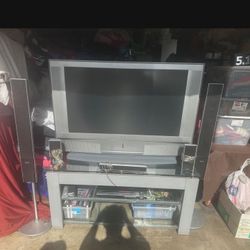 -Sony TV With Table And Surround Sound-