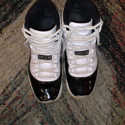 Black and white jordan 11s