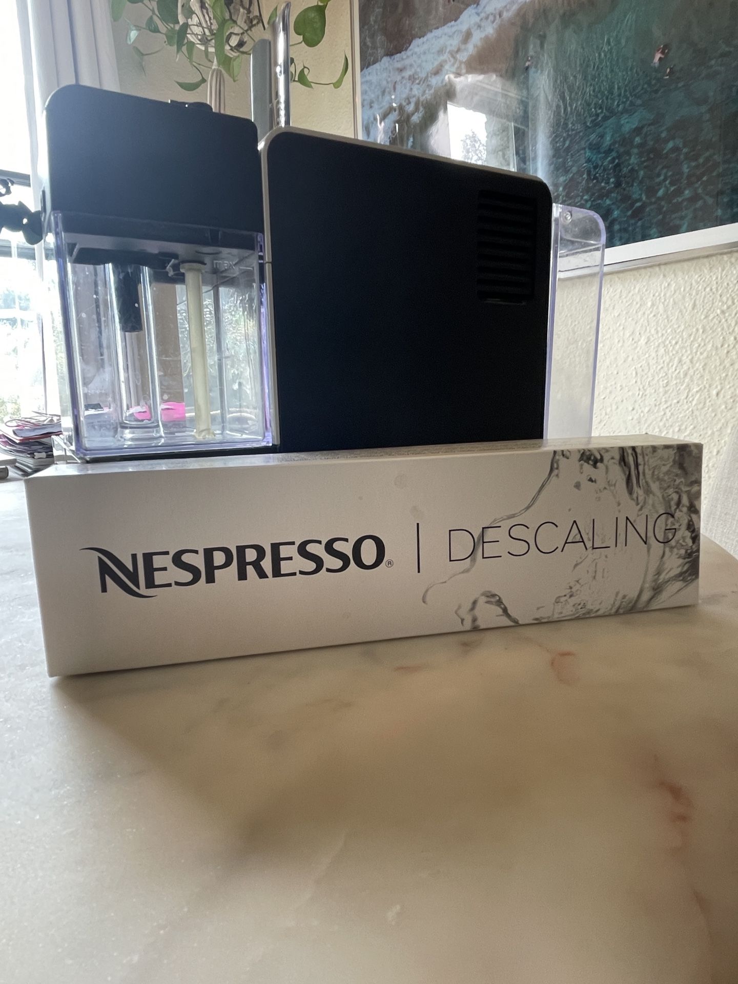 Nespresso DēLonghi machine / white