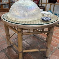 A pair of round bamboo coffee table with glass tops vintage 1960s