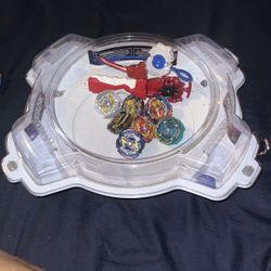 7 Authentic Beyblades With 2 Launches (left And Right) And A Stadium 