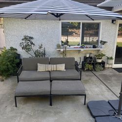 Outdoor patio umbrella and sofa