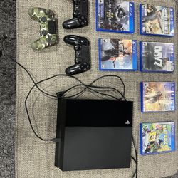 PS4 With 6 Games And 3 Sony Controllers