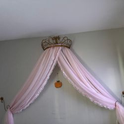 Canapy  with curtains and it’s metal not plastic