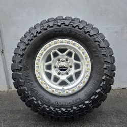 17" KMC rims w/ 35" Toyo Open Country MT tires