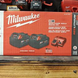 Two 5.0 Milwaukee Batteries With Charger 