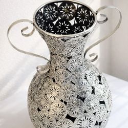 Beautiful decorative metal vase with intricate design. Great for living room, entryway, or centerpiece