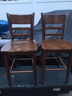 2 high chairs brown