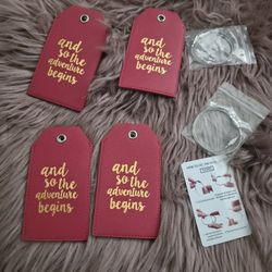 Casmonal 4 piece luggage tag set. Red faux leather with “and so the adventure begins” on each one. Comes with attaching wire.