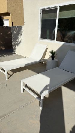 CB2 white lounge chairs