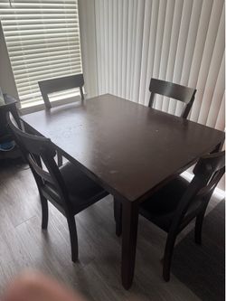 Table set with four chairs