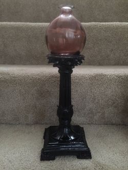 Candle holder with a little glass vase on top