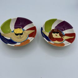 SET OF 2 CLAY ART DIPPING BOWLS HAND PAINTED MAN WOMAN IN POOL SUMMER 5” X 2.5”.  These are very cute and show a man and a woman leaning on the edge o