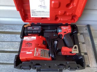 Milwaukee M18 FUEL Impact Driver With One XC5.0 Battery And M18 Charger.  Brand NEW.