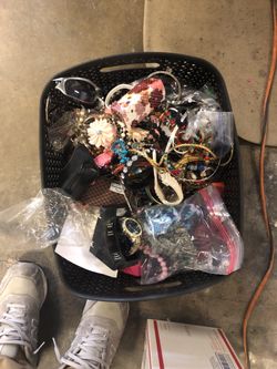 Basket of jewelry necklaces, rings, earrings