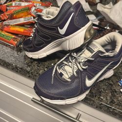 purple Nike gym shoes