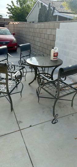 Table And Metal Chairs. Patio Furniture.