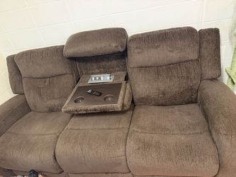 Brown couch with dropdown console