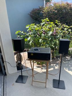 ONKYO RECEIVER WITH ONKYO SPEAKERS AND STANDS.