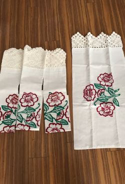 Four embroidered pillowcases