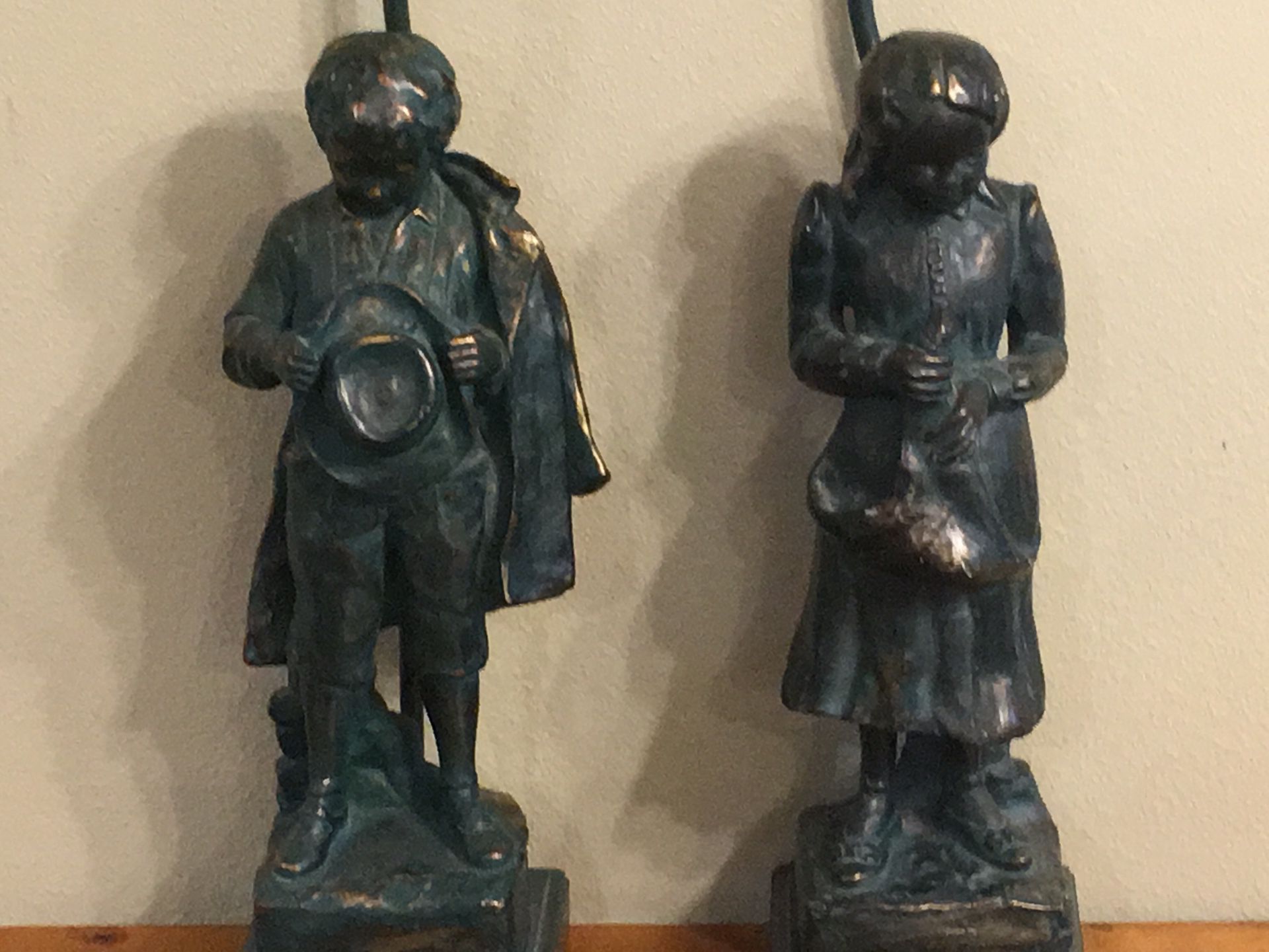 Antique boy and girl lamps
