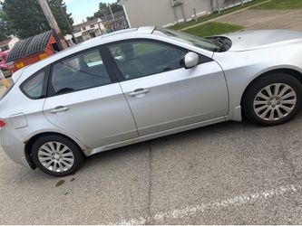 Silver Subaru Impreza Hatchback