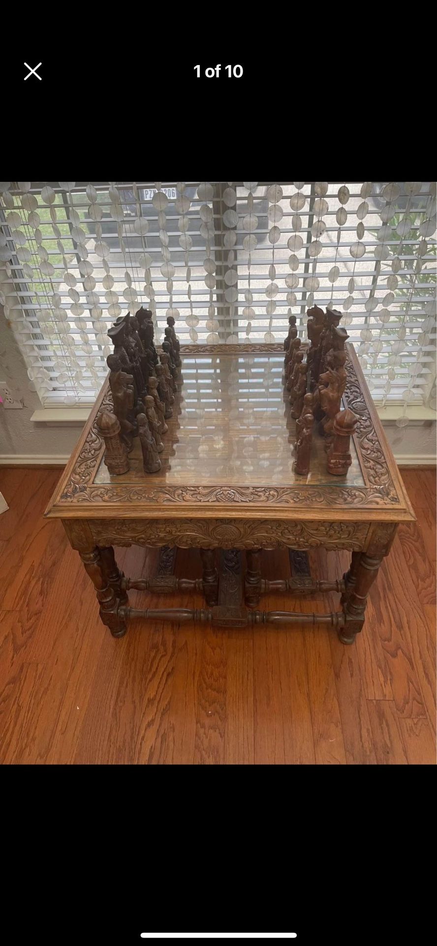 Contemporary hand carved chess table with 2 benches and a complete set of incredibly detailed hand carved chess pieces.