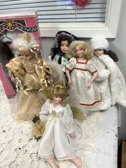 6 vintage Porcelain and cloth dolls.