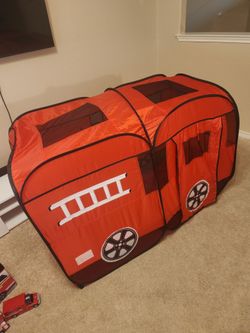Kids firetruck tent, toy trucks, and firetruck bin