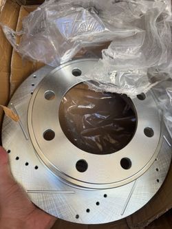 Front drilled and slotted brake rotor Ford F250 through 350 check description for a year and Fitbit