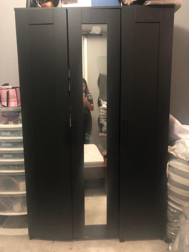 Black IKEA armoire cabinet with mirror doors