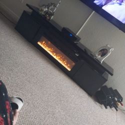 New TV Stand In Box Minus Fireplace