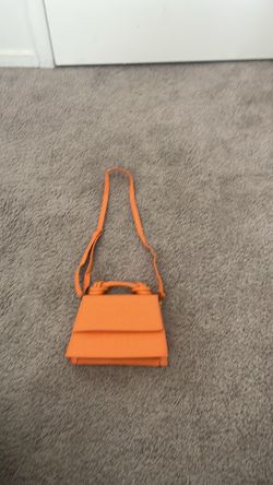 Orange adjustable strap purse