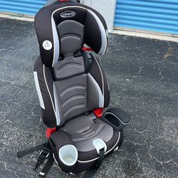 Graco Adjustable Booster Car Seat! Meant to be used with seatbelt across chest. 
