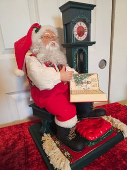 $50.00 - 1990's Animated Christmas Santa next to Working Grandfather Clock! Includes non tested Casette Player!