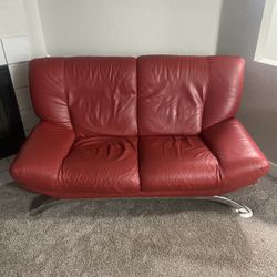 Red leather Couch. 
