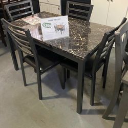 Dinner table with chairs