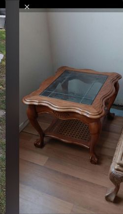 Wooden side table with glass top