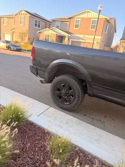 Ram 3500 black stock rims