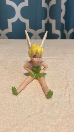 Sitting, pouting Tink