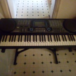 Black in white keyboard with the stand that, Gos to It .