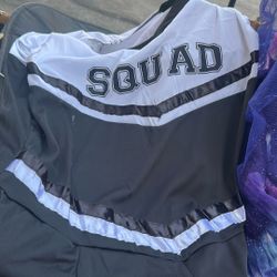 A cheerleader dress with the pom-poms size 2