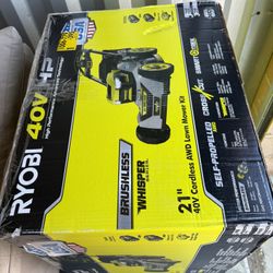 Brand new 21” Ryobi brushless crosscut blades electric lawn mower with 2 6Ah lithium ion batteries and Rapid charger