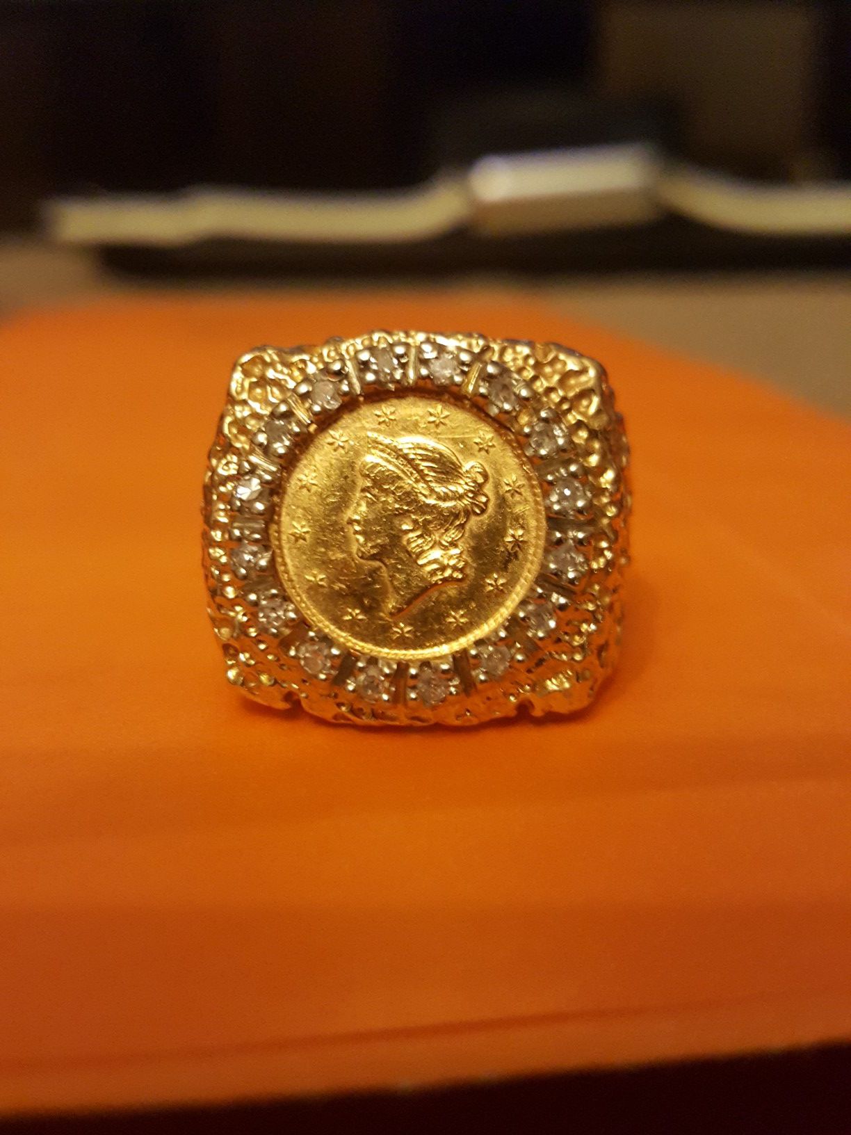 GOLD COIN RING W/ONE DOLLAR LIBERTY GOLD COIN 1851 SIZE 8 DIAMOND BEZEL RING IS 10K, 11.3 GRAMS NUGGET STYLE .I AM FIRM $950. YES STILL AVAILABLE.