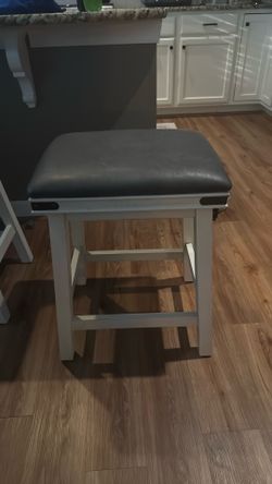 4 matching navy blue barstools (2 ft tall 18 in wide)