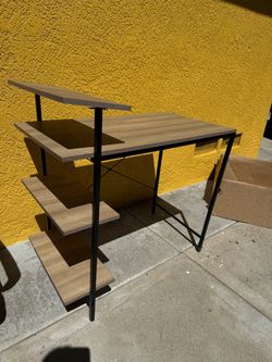 desk (wood color with black frame)