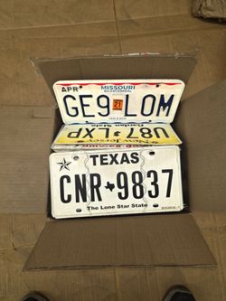 Box of license plates all 50 states mix  about 50 plates total