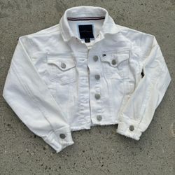 White Tommy Hilfiger denim jacket with a kids size Small 